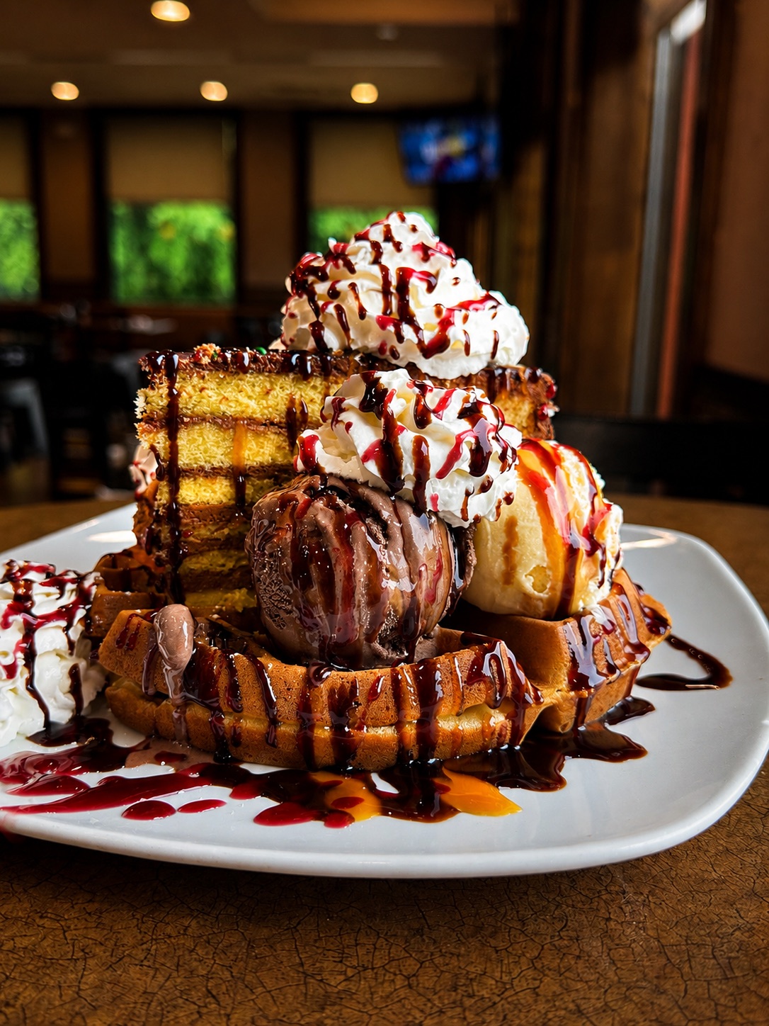 Waffle sundae with ice cream and chocolate drizzle